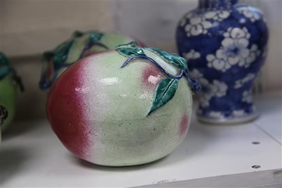 A pair of Chinese enamelled porcelain models of peaches, 19th century, length 16.5cm